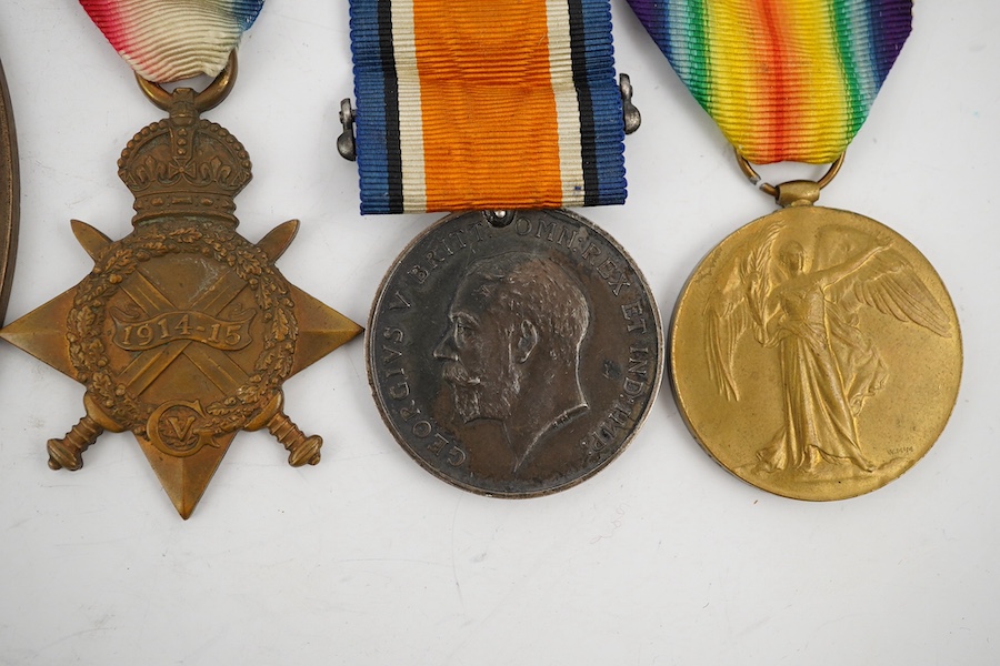 A First World War medal trio and commemorative plaque awarded to PTE. R. Docherty S. GDS. Condition fair.